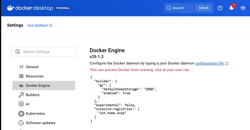The Docker Engine settings screen in Docker Desktop displaying the JSON configuration file for the Docker daemon.